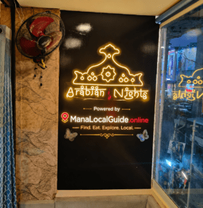 Arabian Nights restaurant interior signboard in Guntur